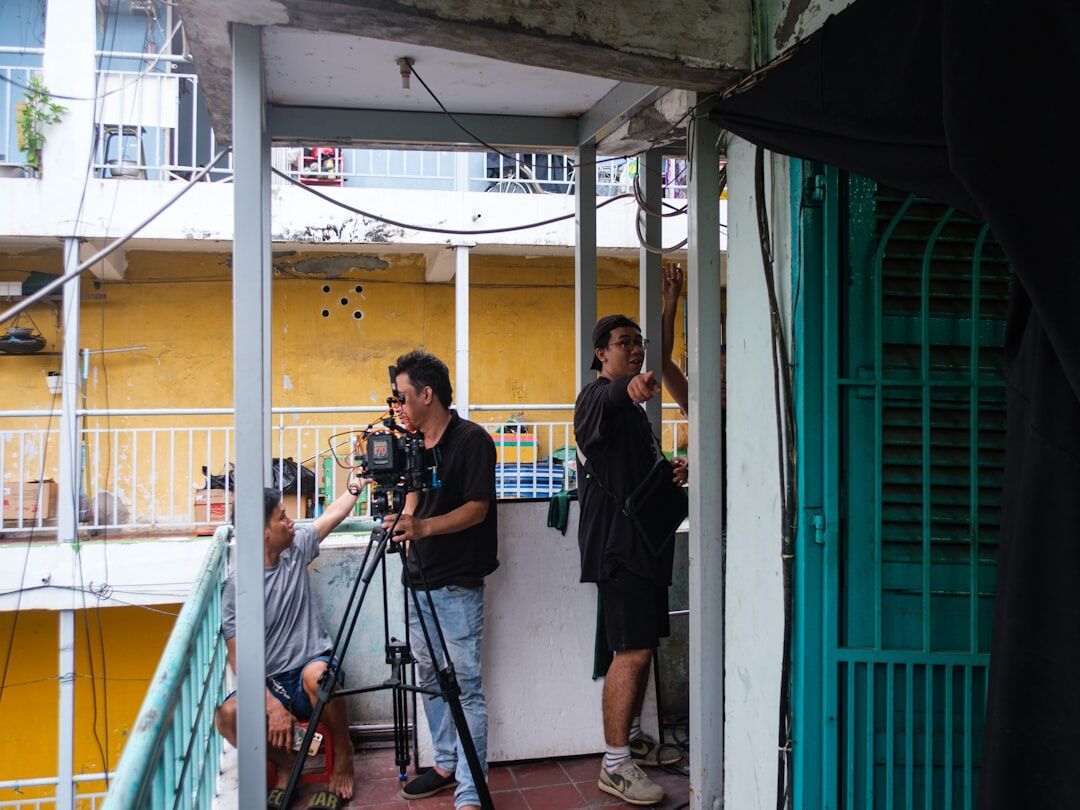 Journalist interviewing a local resident outdoors with a microphone