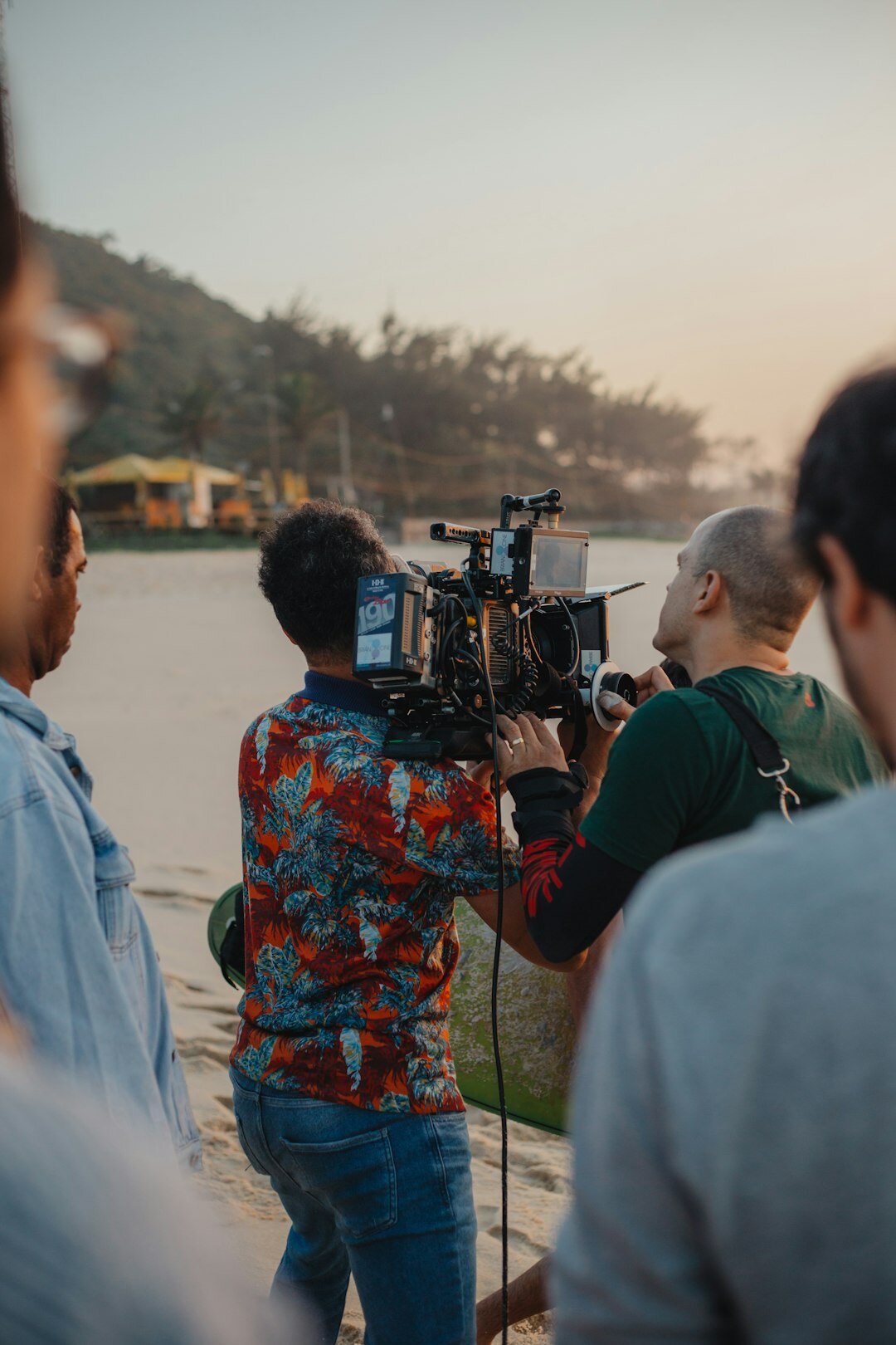 Small editorial team reviewing a video sequence together on a screen